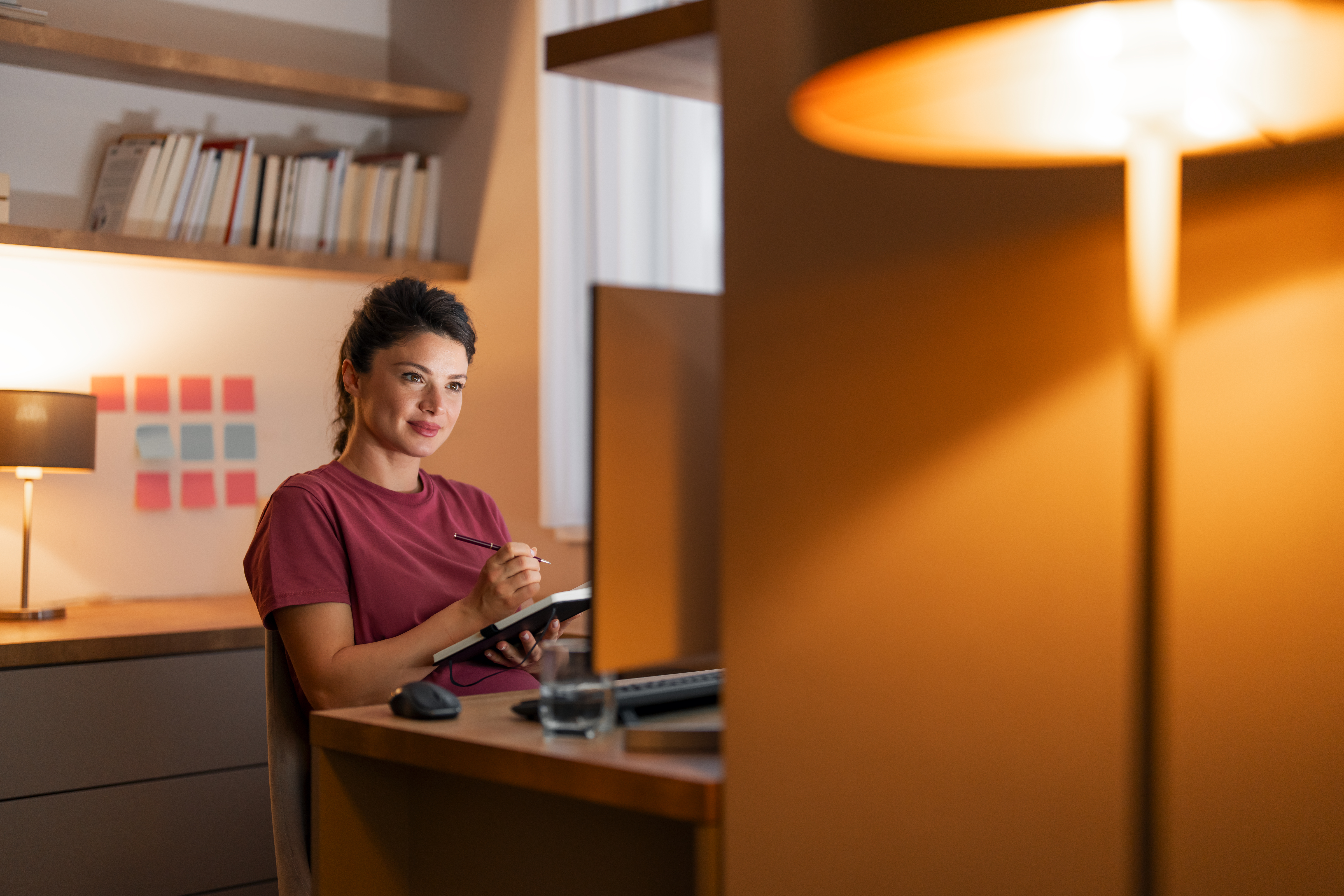 A satisfied mid adult woman watching an online sem