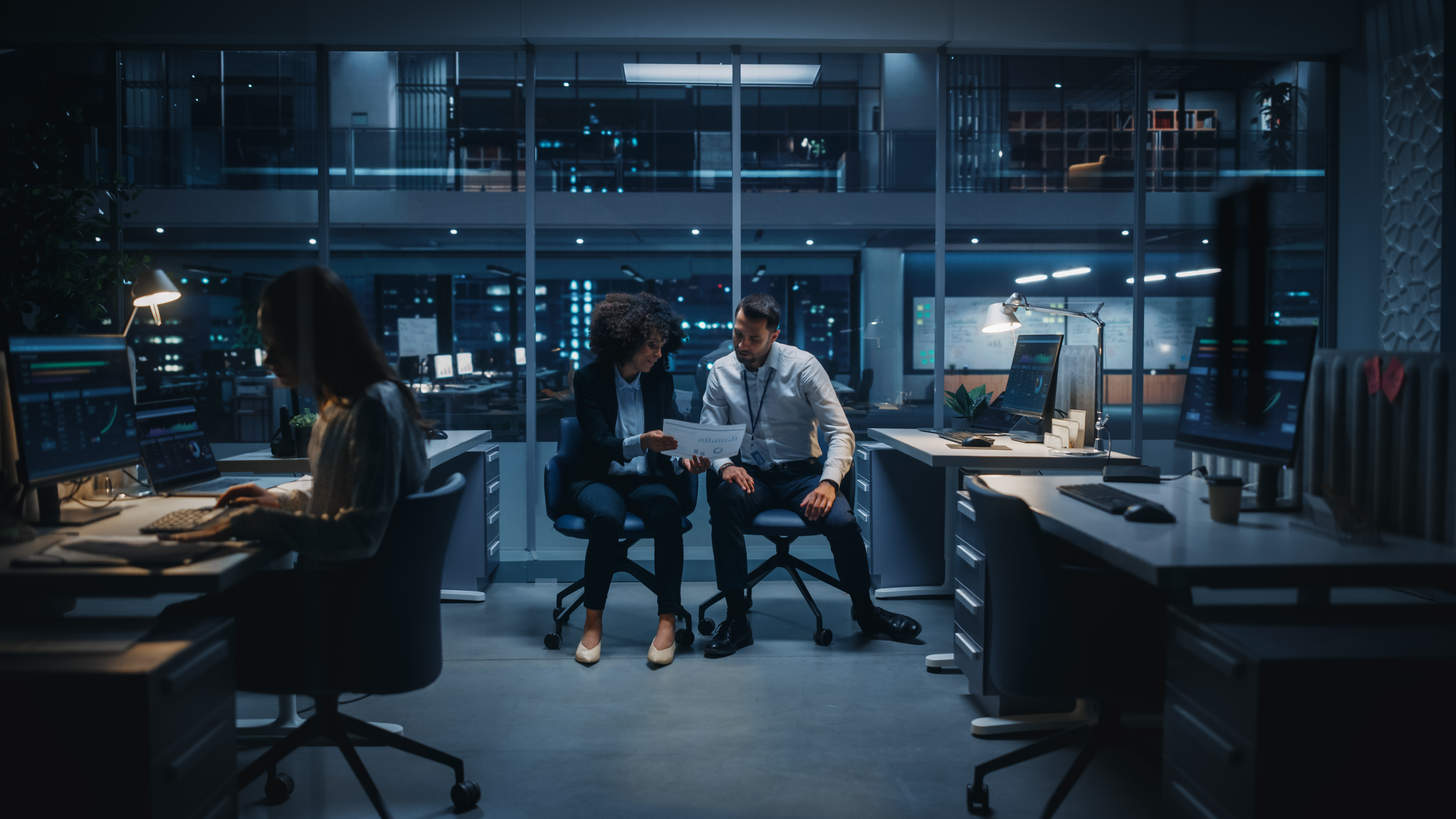 Diverse team of managers working on computers behi