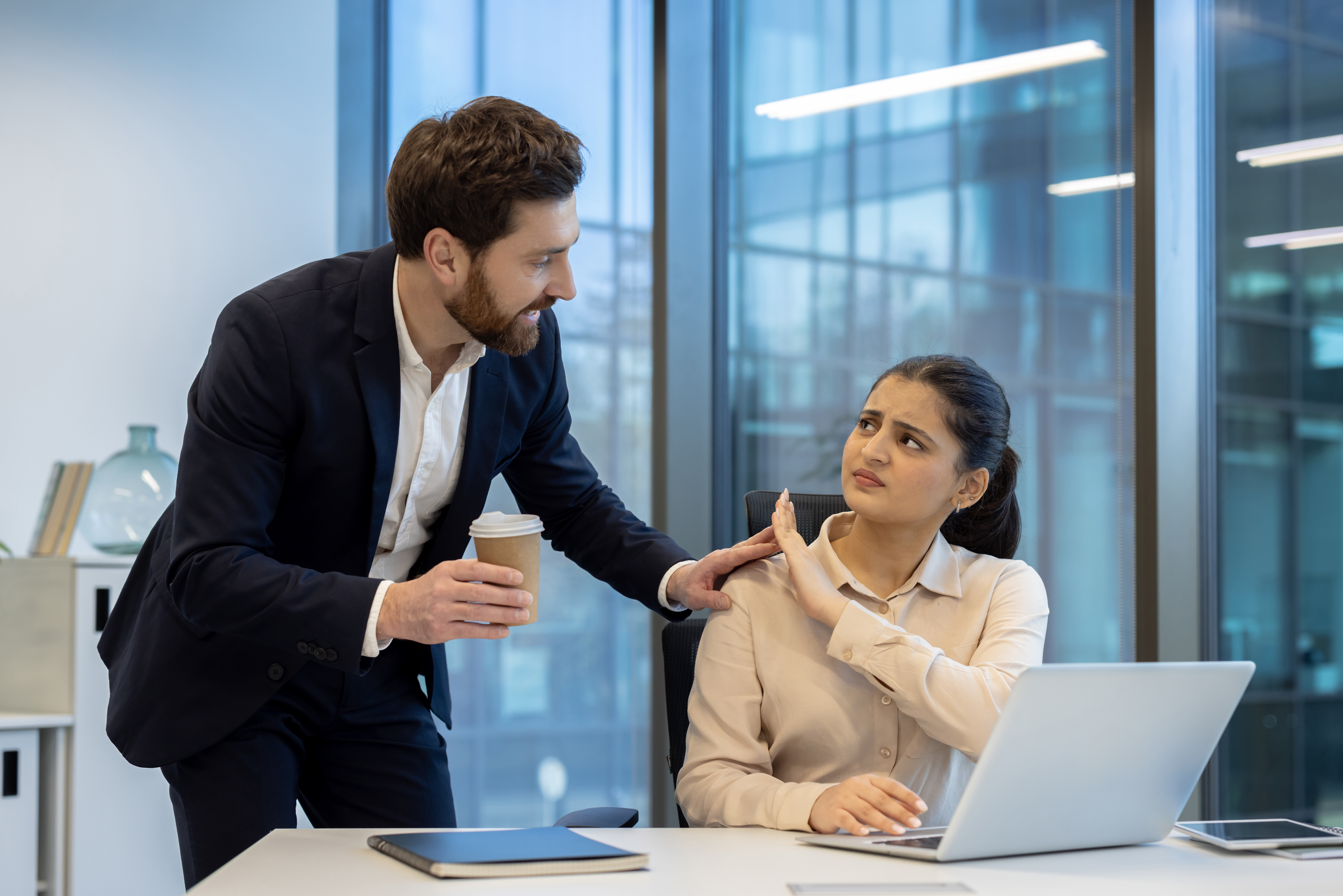 A boss extends an arm towards an employee suggest