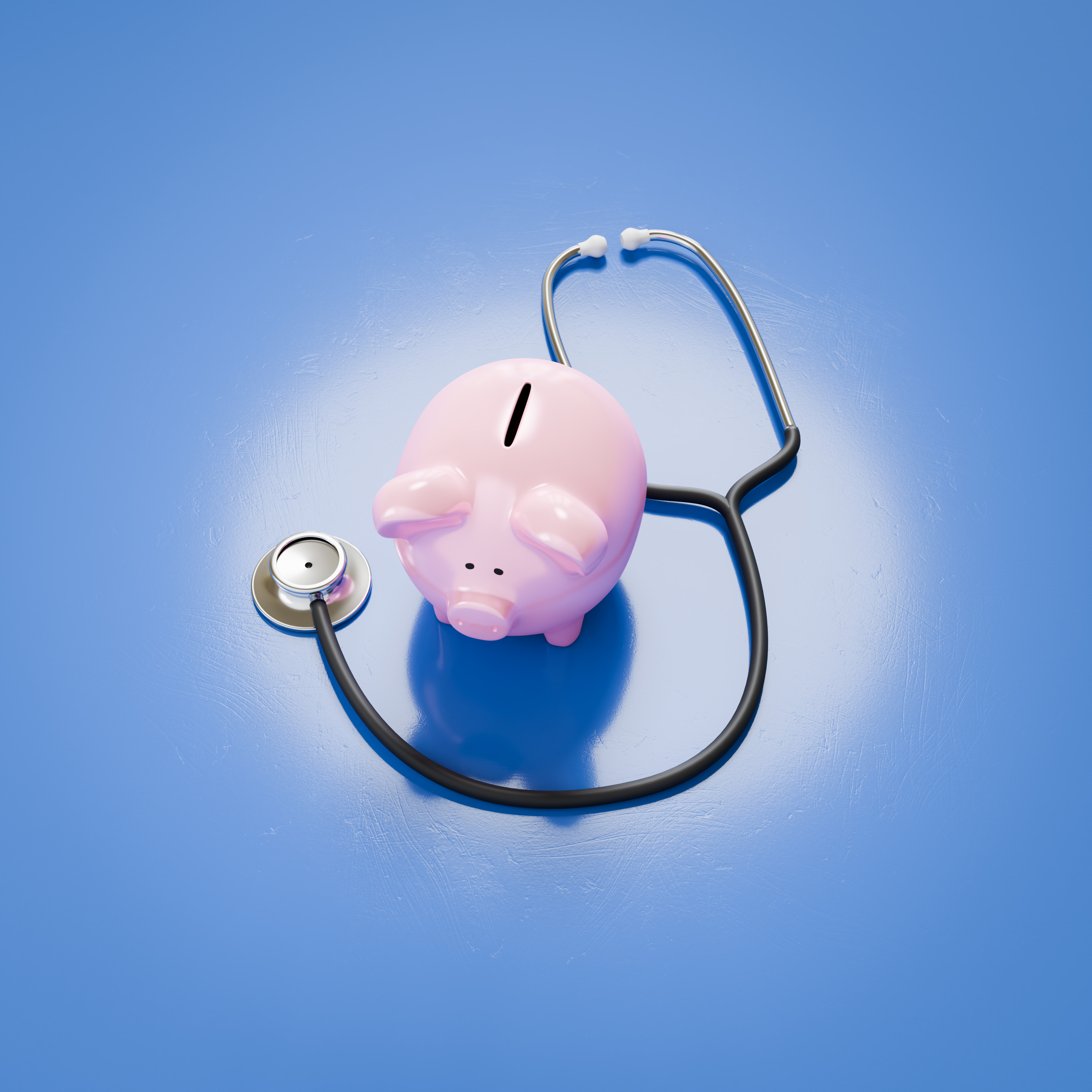 A piggybank besides a stethoscope concept for sav