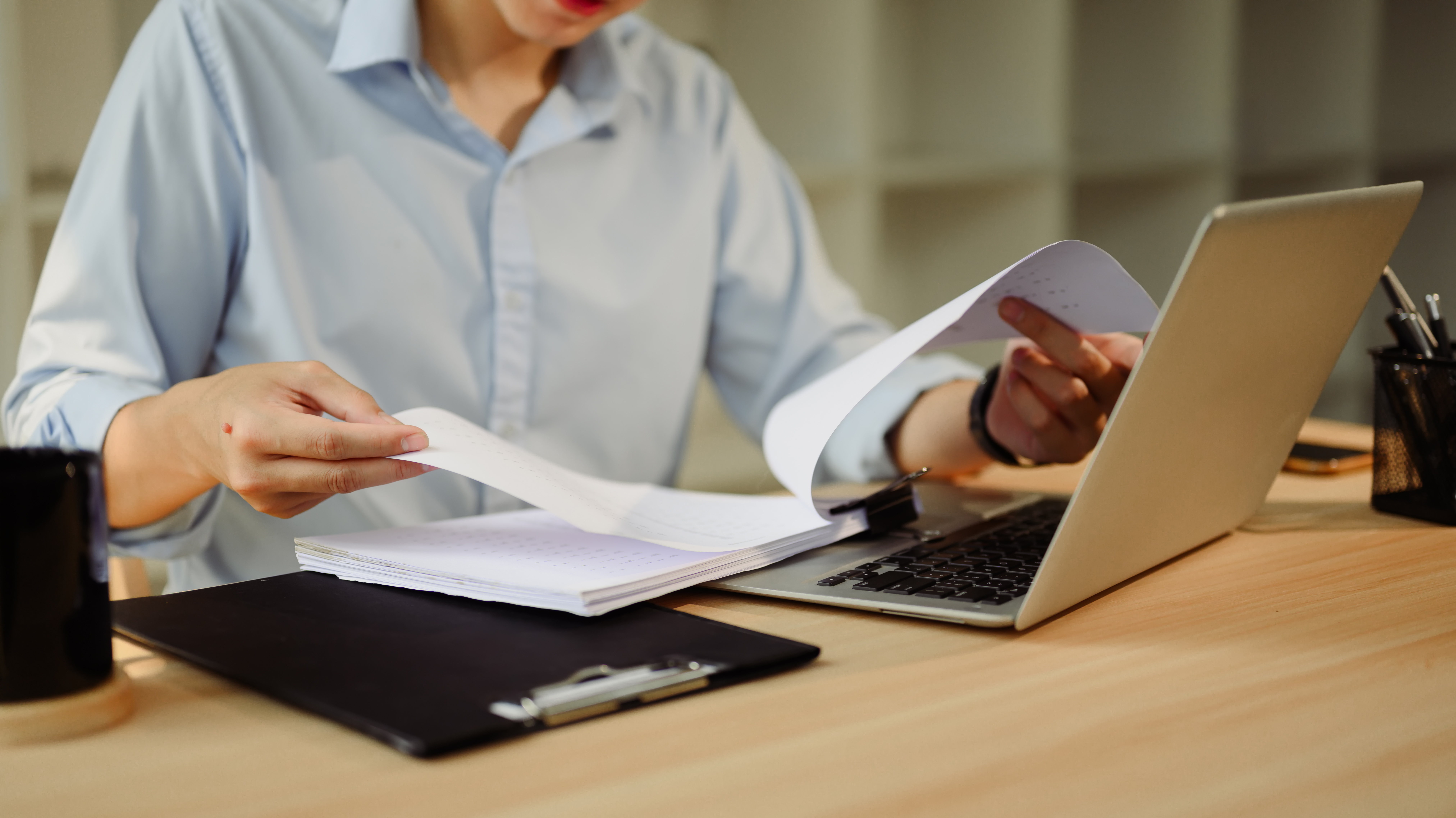 Focused businessman working with laptop and