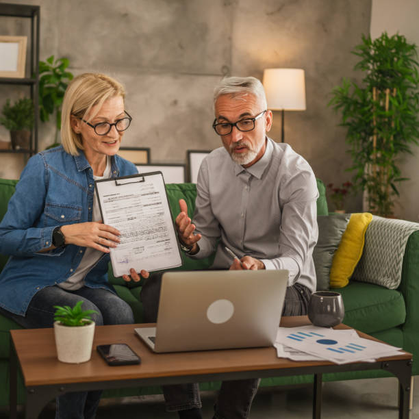 Mature man and woman work form home have consultat