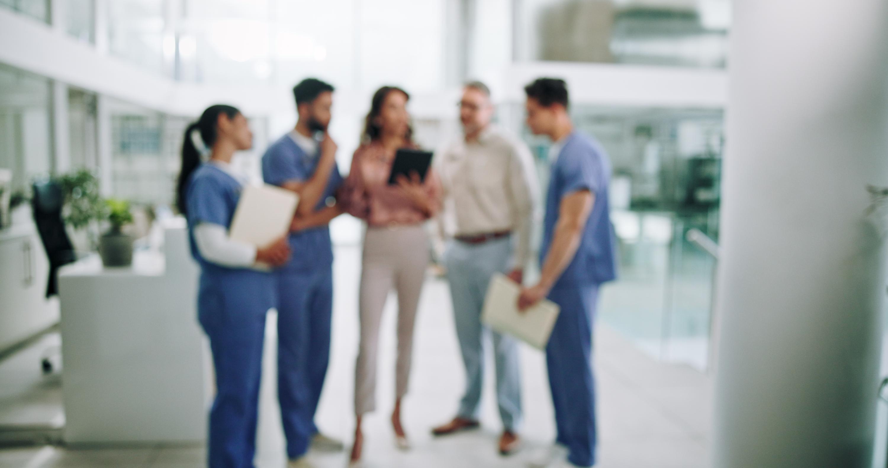 Hospital chief blur and planning with doctors and