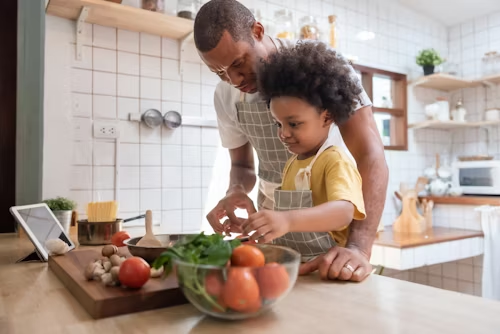 A family and small business owner reviewing insurance policies together at a kitchen table, symbolizing protection and peace of mind through umbrella coverage.
