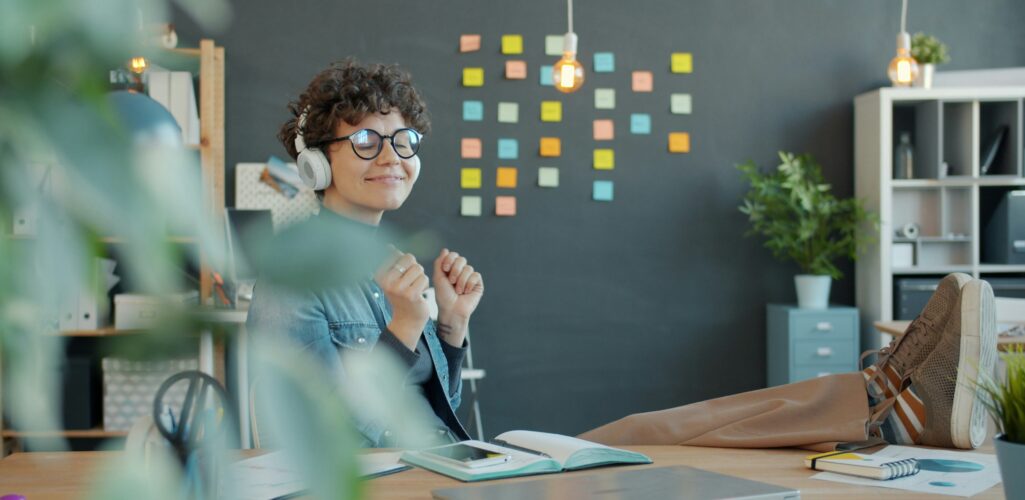 HR manager reviewing a digital wellness dashboard, symbolizing guided employee care and streamlined health benefits.
